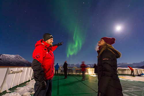 Tourists enjoying the Northern Lights on board MS Nord-Norge