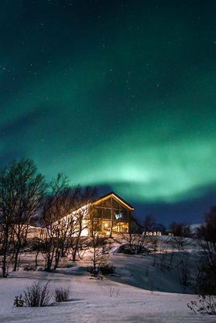 Snow hotel service building, Northern Lights. Photo by Kirkenes Snow hotel