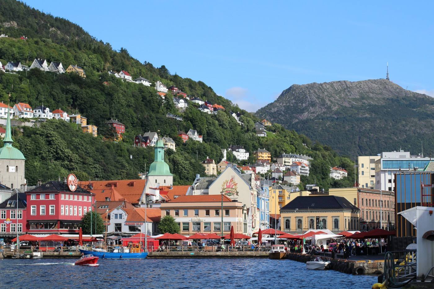 Bergen Norway, the Fish Market, hillsides and mount Ulriken. Photo by Rita de Lange, Fjord Travel Norway