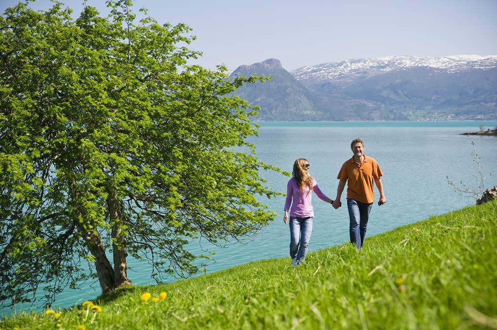 Couple enjoying the Hardangerfjord by CH, Visit Norway