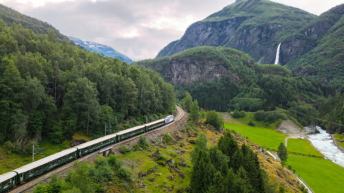 Flåmsbana Railway Train In Mountain by Fjord Travel Norway